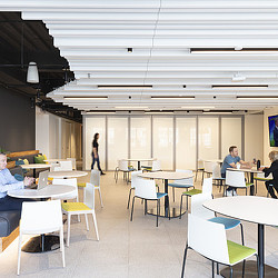 A group of people sitting at tables.