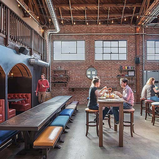 People sitting at tables in a room.