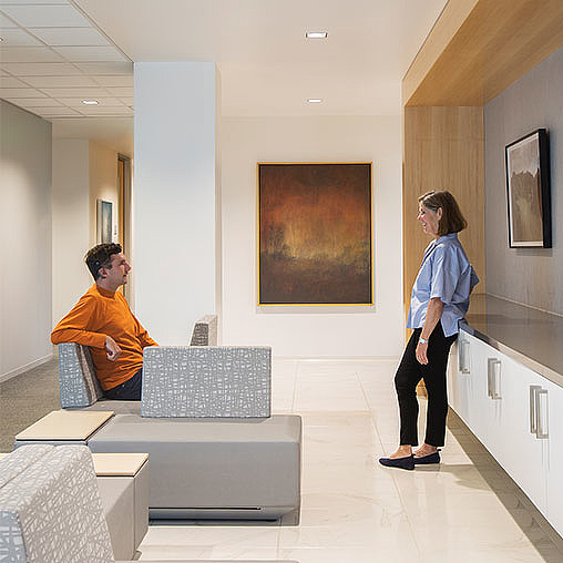 A man and a woman in an office.