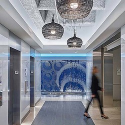 A person walking through a hallway.