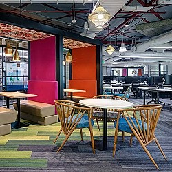 A room with tables and chairs.