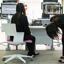 A woman sitting in a chair.