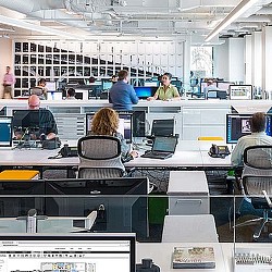 A group of people in an office.