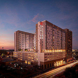 A large building with a road in front of it.