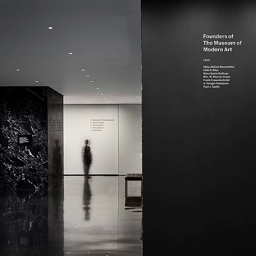 A person standing in a hallway.