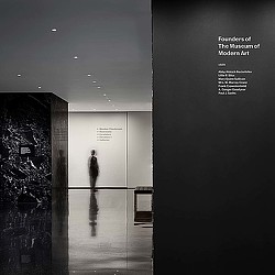 A person standing in a hallway.