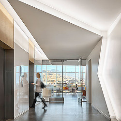 A person walking in a hallway.