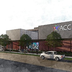 A car parked in front of a building with a sign on it.