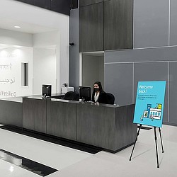 A person sitting at a desk.