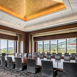 A room with a table and chairs.
