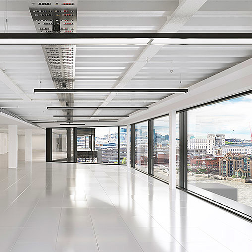 A large room with windows and a large glass door.