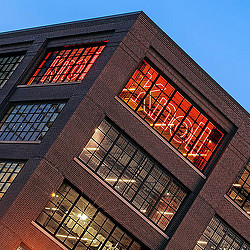 A tall building with a red light.