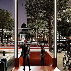 A person standing on a sidewalk.