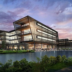 A building with a body of water in front of it.