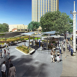 A group of people walking around a park.