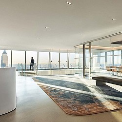 A person standing in a large room.