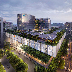 A large building with a pool in front of it.