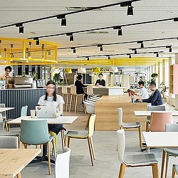 People sitting at tables in a restaurant.