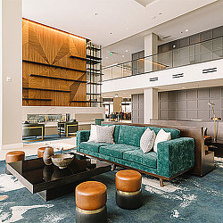 A room with a couch and a coffee table.