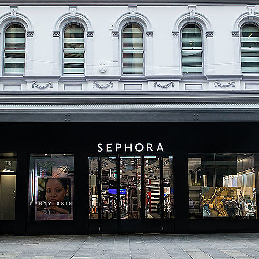 A store front with a sign on the front.