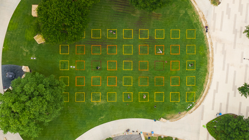 A building with a green lawn.