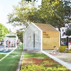 A small building with a sign on it.