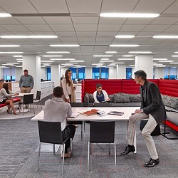A group of people sitting at tables.