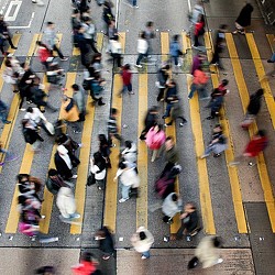 A group of people in a crosswalk.