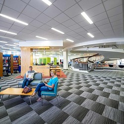 A few people sitting in chairs.