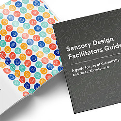 A black and white sign with colorful text.