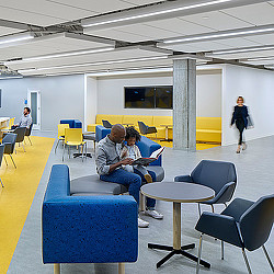 A group of people sitting in chairs.