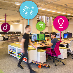 A person standing in front of a computer.