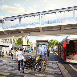 A person walking next to a bicycle.