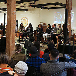 A group of people sitting in chairs.