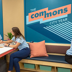 A woman sitting at a desk.