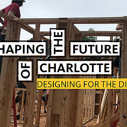 A person standing on a wooden structure.