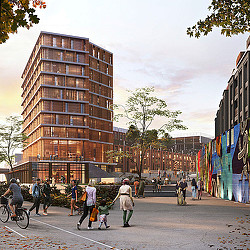 A group of people walking on a street next to a building.