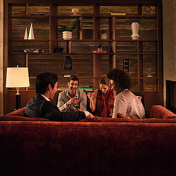 A group of people sitting on a couch.