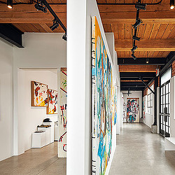 A hallway with art on the walls.