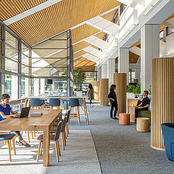 People sitting at tables in a building.