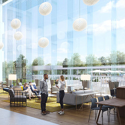 A man and woman standing in front of a large glass wall with lights.