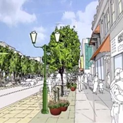 A street with trees and buildings.