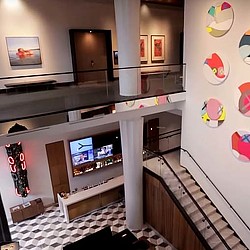 A room with a tv and a piano.