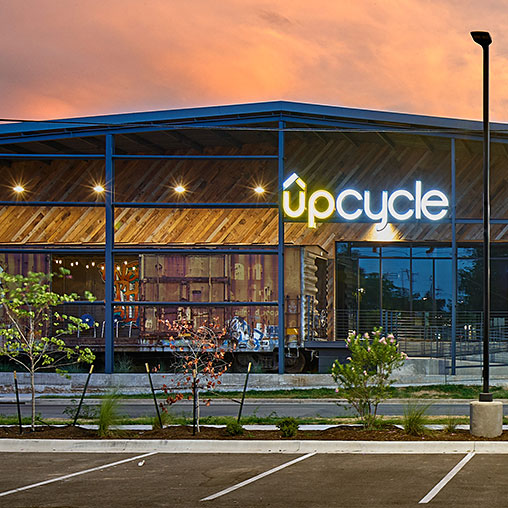 UPCycle building exterior at sunset