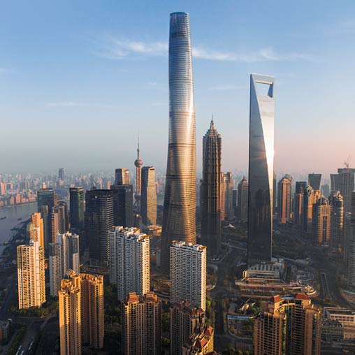 Shanghai Tower with tall buildings.