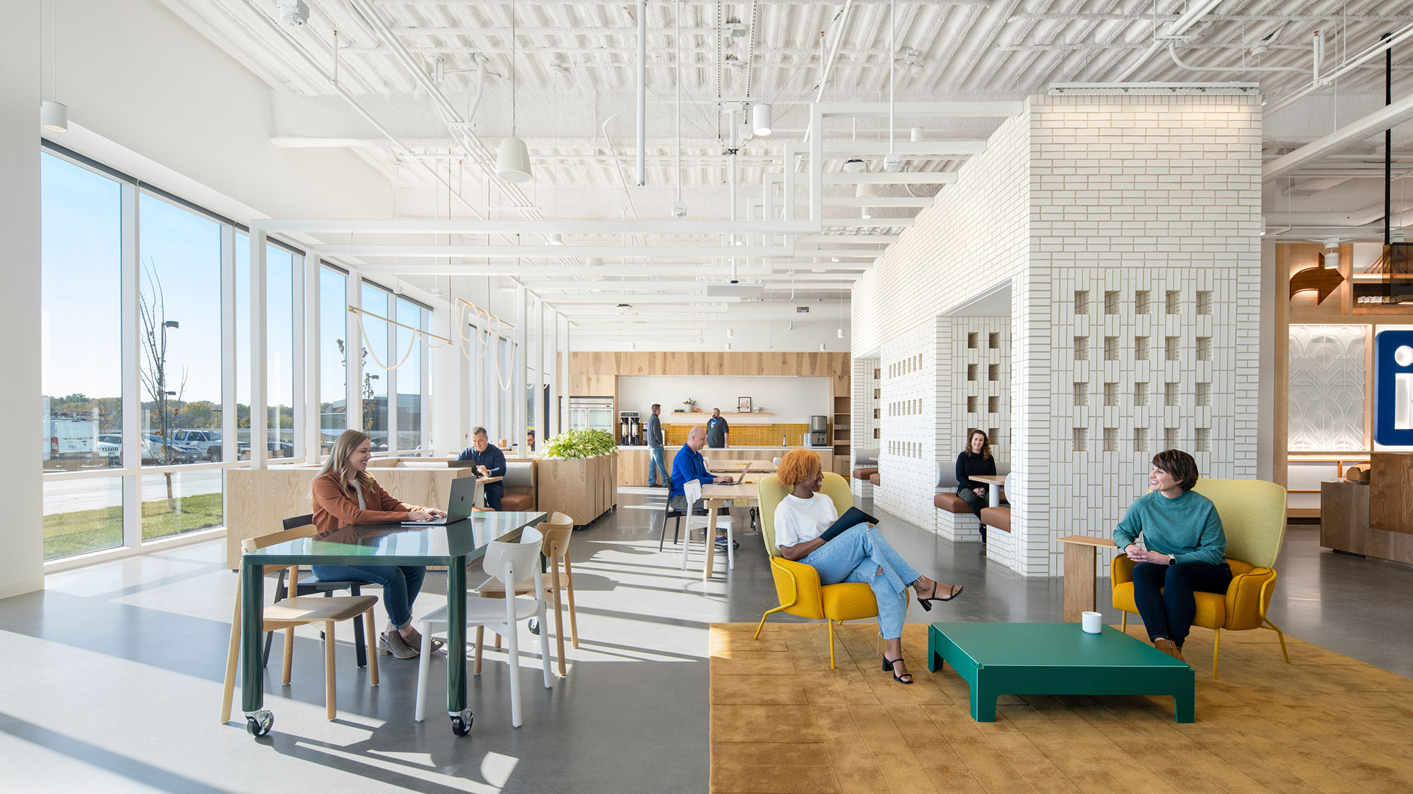 People working in a variety of spaces inside LinkedIn's office in Omaha, Nebraska.