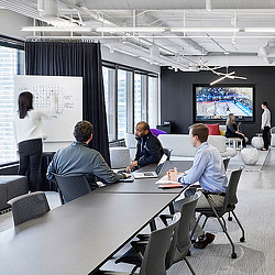 A group of people in a meeting.