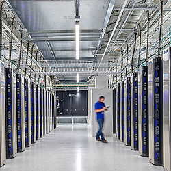 A person standing in a warehouse.