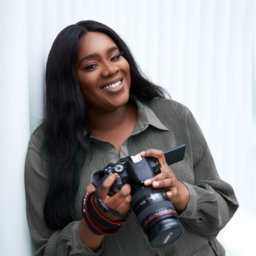 A woman holding a camera.