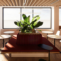A plant in a pot on a red couch in a room with tables and chairs.